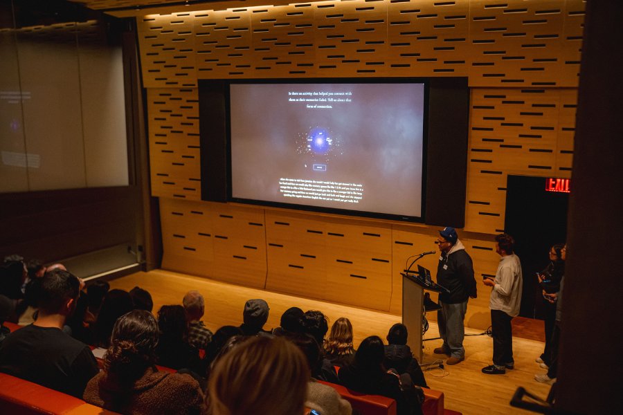 Audience watching the memory-cloud projection